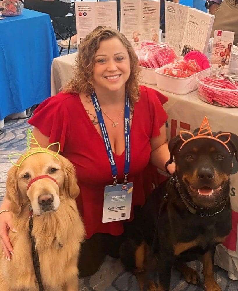 Lady With Two Dogs At Conference